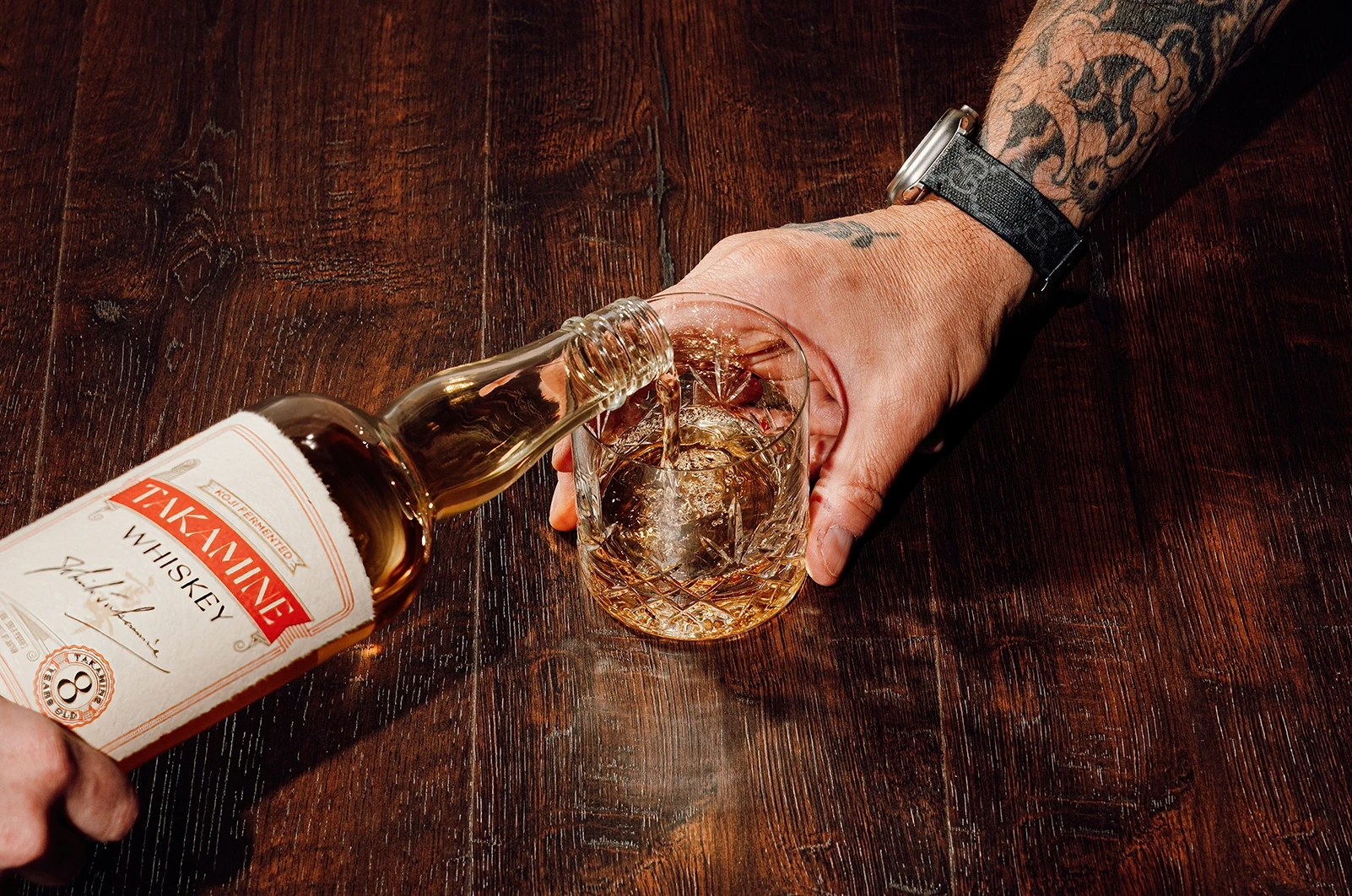 whiskey being poured into a glass